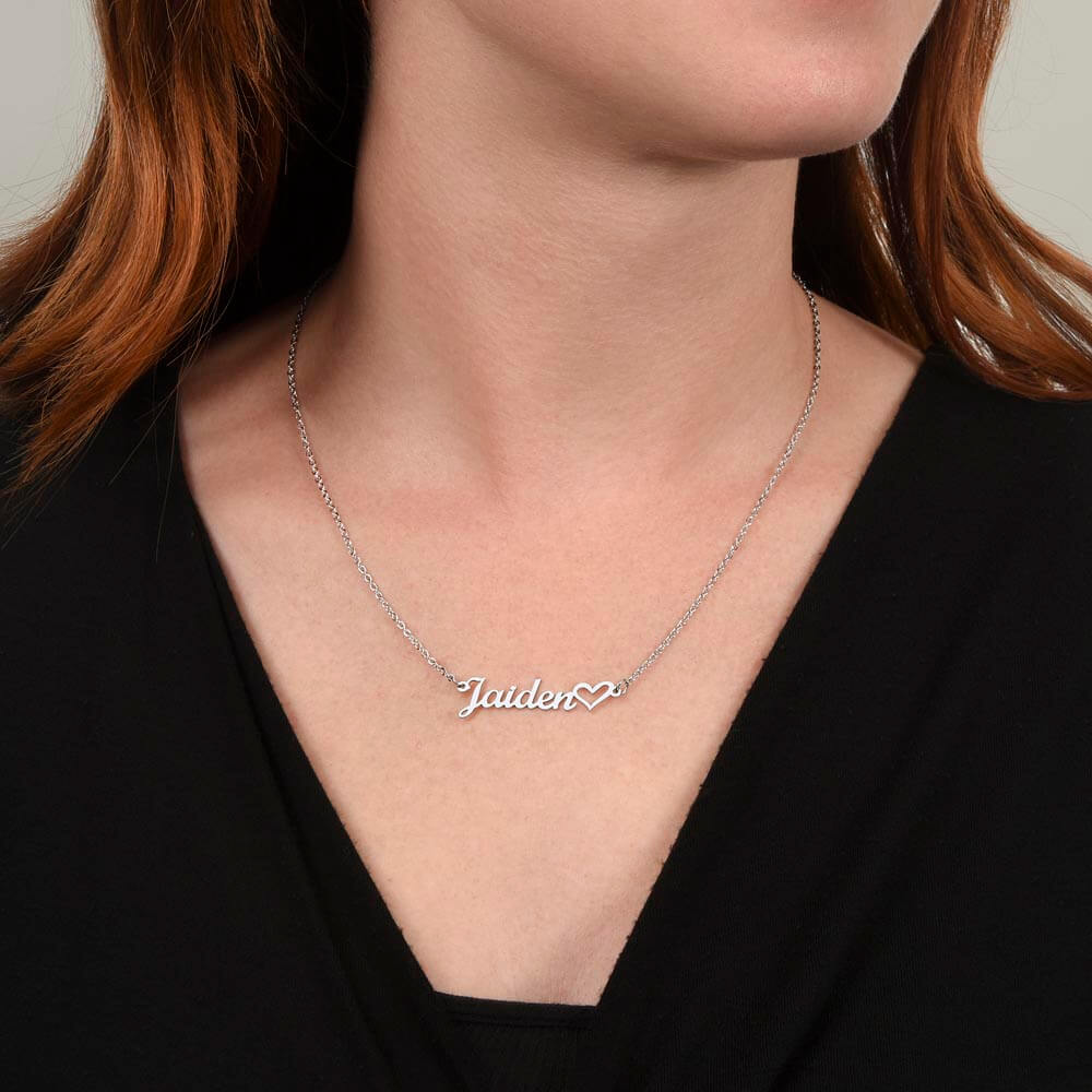 Woman wearing a Personalized Heart Name Necklace with custom name design