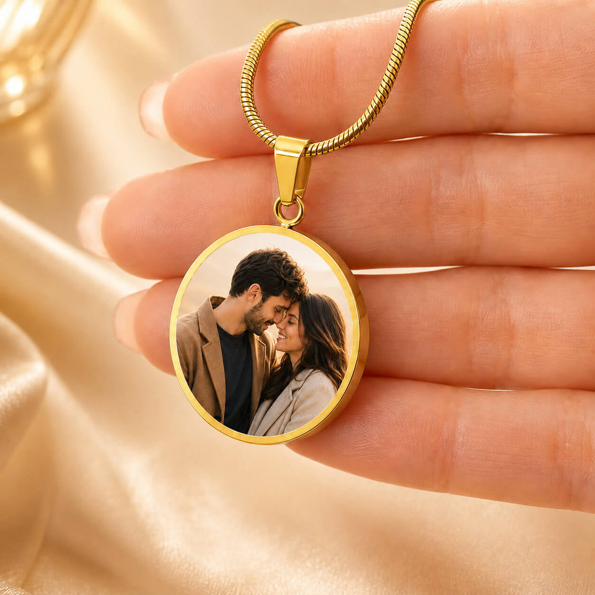 Personalized photo circle necklace in gold held in hand