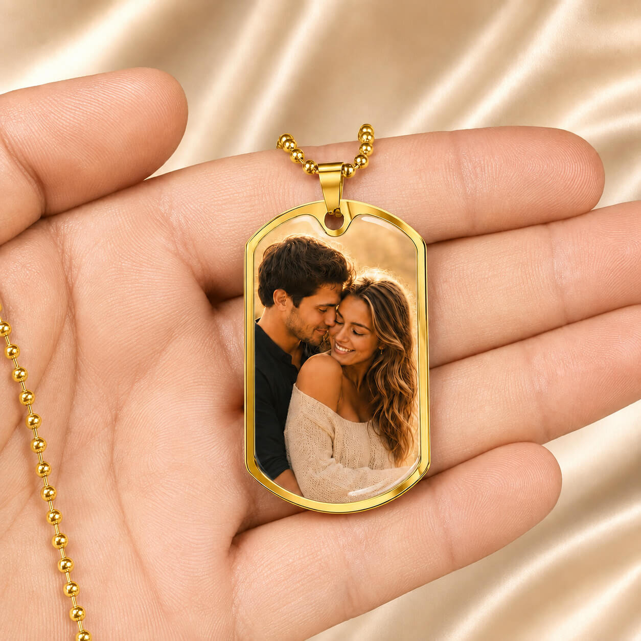 Personalized photo dog tag necklace in gold held in hand
