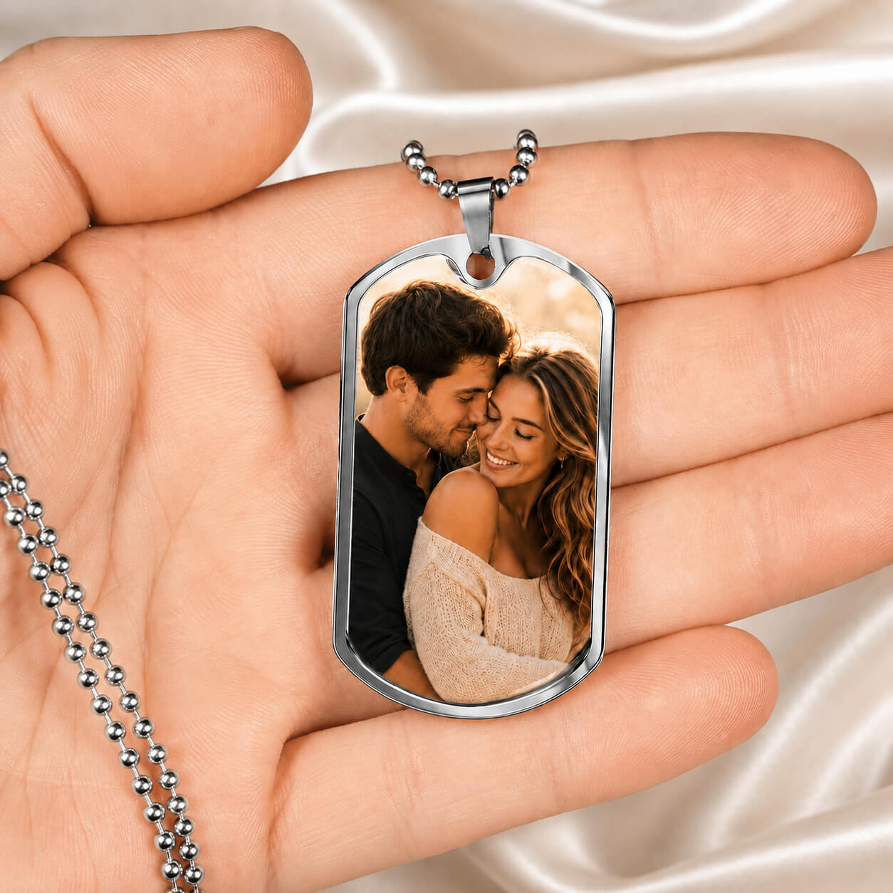 Personalized photo dog tag necklace in silver held in hand